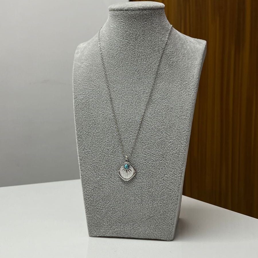 Radiant Turquoise Charm Necklace – Silver Pendant with Sunburst Design